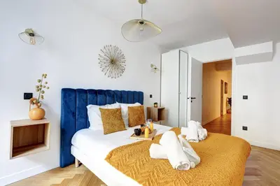 Un ou plusieurs lits dans un hébergement de l'établissement 266 Suite Montefiore Superbe Appartement à Paris
