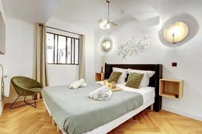 Un ou plusieurs lits dans un hébergement de l'établissement 266 Suite Montefiore Superbe Appartement à Paris
