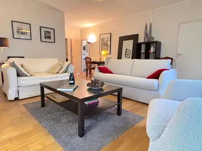 Coin salon dans l'établissement L'appartement Leclerc