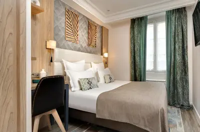 Un ou plusieurs lits dans un hébergement de l'établissement Serotel Suites Opera