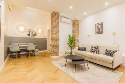 Coin salon dans l'établissement Charmant Appartement 2BR-6P - Gare de l'Est