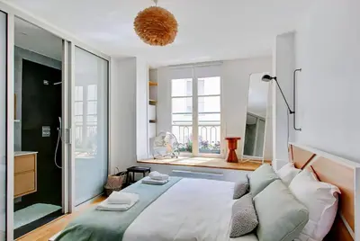 Un ou plusieurs lits dans un hébergement de l'établissement Unforgettable Stay in the Heart of Paris