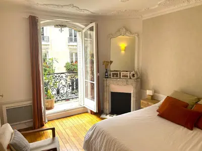Un ou plusieurs lits dans un hébergement de l'établissement Montmartre // Lovely flat for you !