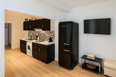 Cuisine ou kitchenette dans l'établissement GAMBETTA résidences hôtel Paris centre