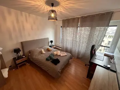 Un ou plusieurs lits dans un hébergement de l'établissement Charme et confort - proche Tour Eiffel Paris 16