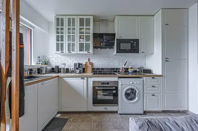 Cuisine ou kitchenette dans l'établissement Charme et confort - proche Tour Eiffel Paris 16
