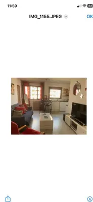 Coin salon dans l'établissement Joli appartement
