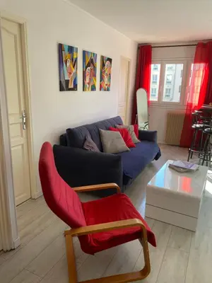 Coin salon dans l'établissement Joli appartement