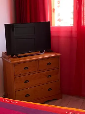 Télévision ou salle de divertissement dans l'établissement Joli appartement