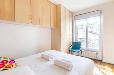 Un ou plusieurs lits dans un hébergement de l'établissement GuestReady - Charm Central in the 14th