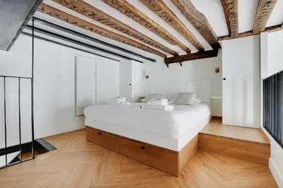 Un ou plusieurs lits dans un hébergement de l'établissement Cozy apartment - 1BR-4P - Place des Victoires