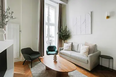 Coin salon dans l'établissement Cozy apartment - 1BR-4P - Place des Victoires