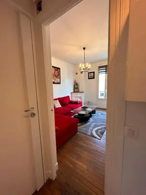 Coin salon dans l'établissement Grand Appt' * Cosy * Proche Paris