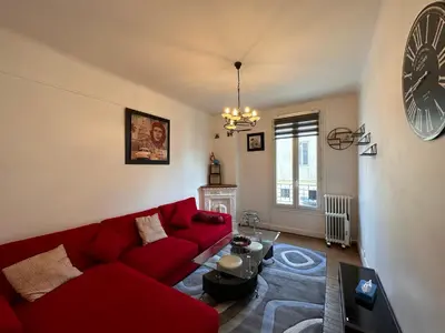 Coin salon dans l'établissement Grand Appt' * Cosy * Proche Paris