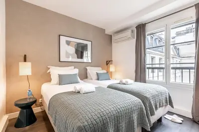 Un ou plusieurs lits dans un hébergement de l'établissement Sweett - Pavillon Opera