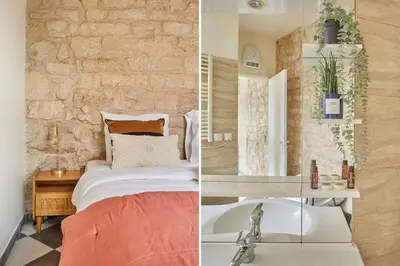 Un ou plusieurs lits dans un hébergement de l'établissement Apartment Center of Paris by Studio prestige