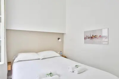 Un ou plusieurs lits dans un hébergement de l'établissement Marais Elegance Suite - Two bedrooms
