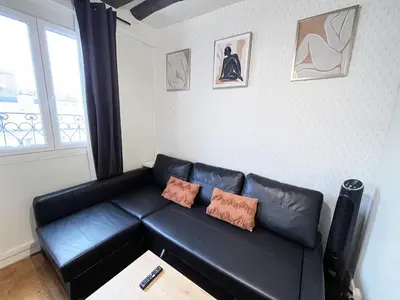 Coin salon dans l'établissement 164 - Charming Studio in Center of Paris