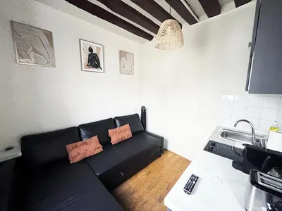 Coin salon dans l'établissement 164 - Charming Studio in Center of Paris