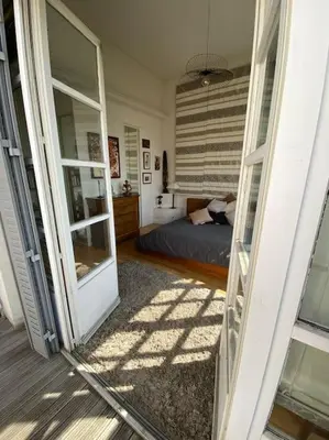 Un ou plusieurs lits dans un hébergement de l'établissement Maison charme 7 min Paris jardin