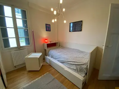 Un ou plusieurs lits dans un hébergement de l'établissement Maison charme 7 min Paris jardin