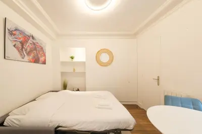 Un ou plusieurs lits dans un hébergement de l'établissement Mgic Apartment 4p Montmartre