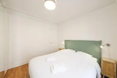 Un ou plusieurs lits dans un hébergement de l'établissement Mgic Apartment 4p Montmartre