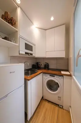Cuisine ou kitchenette dans l'établissement Mgic Apartment 4p Montmartre