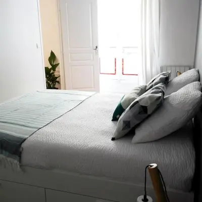 Un ou plusieurs lits dans un hébergement de l'établissement Appartement Haussmanannien Cosy - République