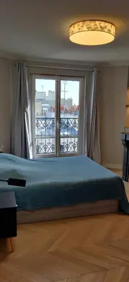Un ou plusieurs lits dans un hébergement de l'établissement Bel appartement 50 m2