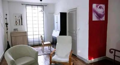 Coin salon dans l'établissement Une petite maison en ville