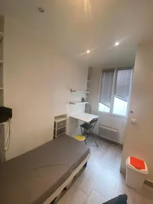 Un ou plusieurs lits dans un hébergement de l'établissement Small studio near Eiffel Tower