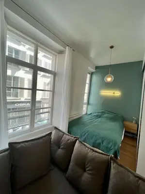 Un ou plusieurs lits dans un hébergement de l'établissement Cozy studio in center Paris (quartier Marais)