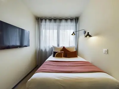 Un ou plusieurs lits dans un hébergement de l'établissement Hife Gentilly Paris Sud Porte d'Italie