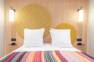 Un ou plusieurs lits dans un hébergement de l'établissement Yuna Saint-Germain-des-Prés - Serviced Apartments