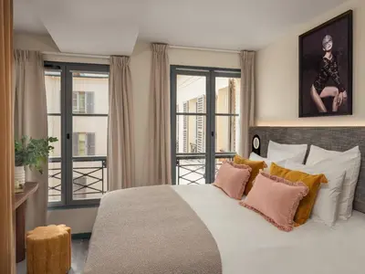 Un ou plusieurs lits dans un hébergement de l'établissement Boudoir des Muses