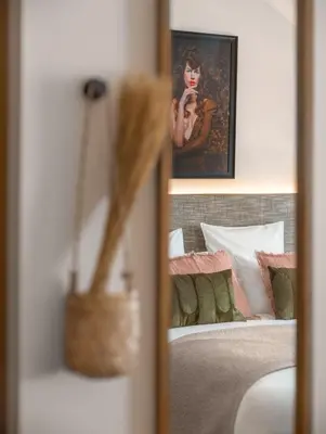 Un ou plusieurs lits dans un hébergement de l'établissement Boudoir des Muses