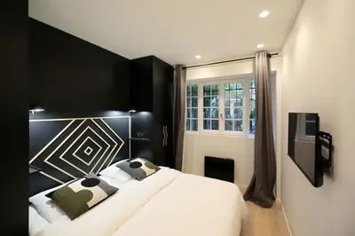 Un ou plusieurs lits dans un hébergement de l'établissement Appartement familiale sauna Paris 10 - 8P - FLAT-GUEST