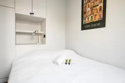Un ou plusieurs lits dans un hébergement de l'établissement Appartement Folie-Méricourt - Welkeys