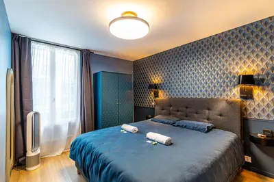 Un ou plusieurs lits dans un hébergement de l'établissement GuestReady - Glamourous getaway in the 20th Arr.