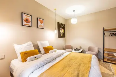 Un ou plusieurs lits dans un hébergement de l'établissement Lovely apartment in the heart of Paris