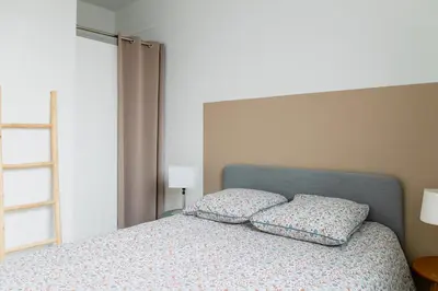 Un ou plusieurs lits dans un hébergement de l'établissement Appartement F3 55m2 à 5' de Paris