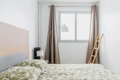 Un ou plusieurs lits dans un hébergement de l'établissement Appartement F3 55m2 à 5' de Paris