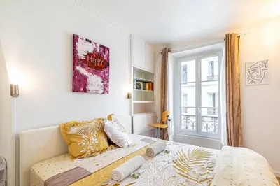 Un ou plusieurs lits dans un hébergement de l'établissement GuestReady - Appartement baigné de lumière au 7e.