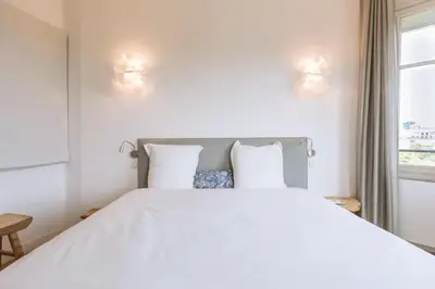 Un ou plusieurs lits dans un hébergement de l'établissement Central&Spacious 2BD Apart for 4 in Champs Elysées