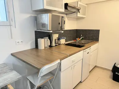 Cuisine ou kitchenette dans l'établissement Charming intim apartment in Paris South