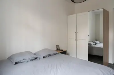 Un ou plusieurs lits dans un hébergement de l'établissement Appartement spacieux et confortable à Paris 17ème