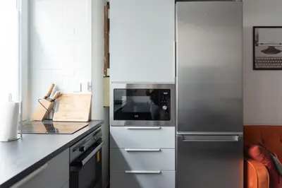 Cuisine ou kitchenette dans l'établissement Appartement spacieux et confortable à Paris 17ème