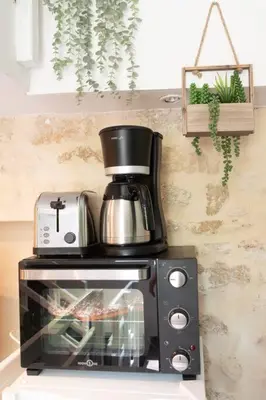 Cuisine ou kitchenette dans l'établissement Duplex Parisien charmant en face métro13
