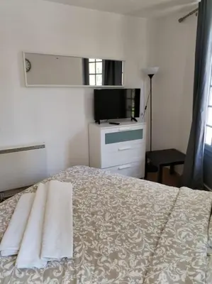 Un ou plusieurs lits dans un hébergement de l'établissement Studio Saint-Jacques